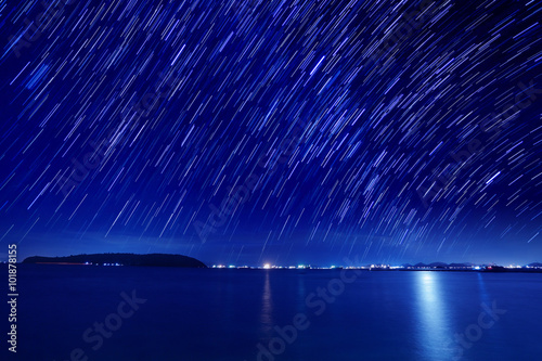 The motion beautiful star trail image during the night in the se photo