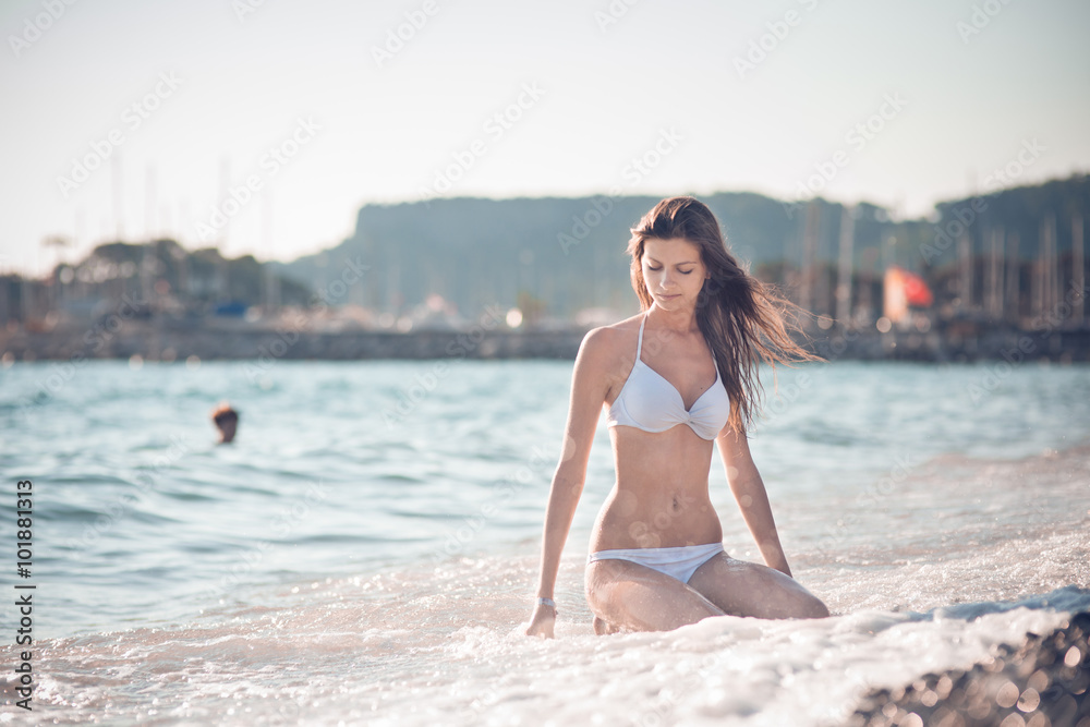 beautiful girl have a seasonal winter vacation on the beach