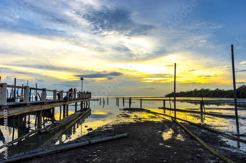 Jetty silhouette with sunset background