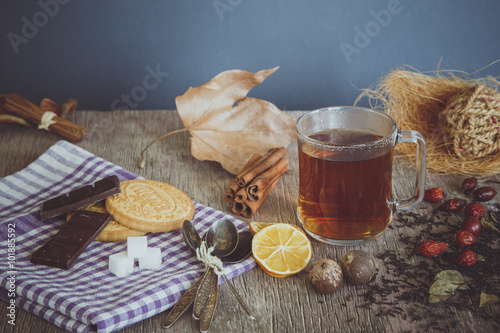 Tea with sweets, lemon and briar photo