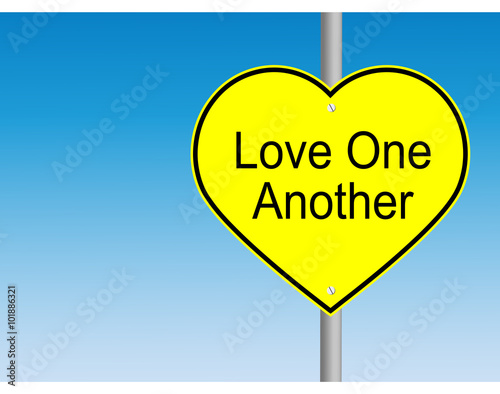 Love one another yellow road sign