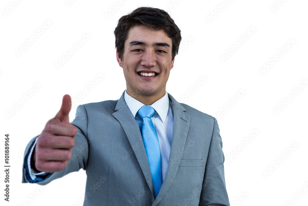 Smiling asian businessman showing thumbs up Smiling asian businessman showing thumbs up