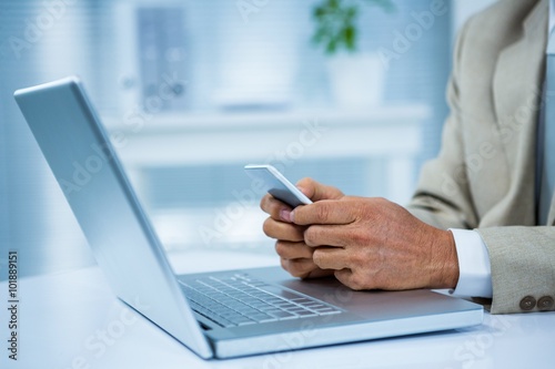 close up view of a businessman using his phone