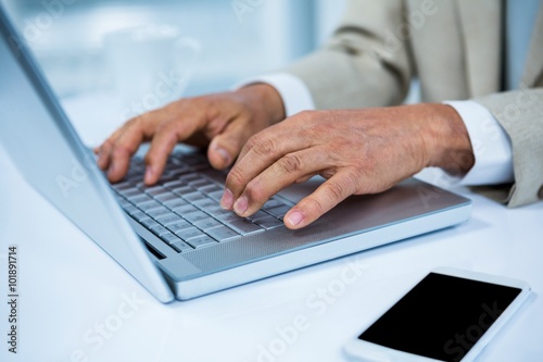 close up view of a businessman using his laptop