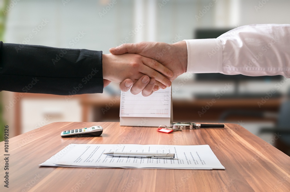 Ταπετσαρία Shakehand of lawyer and business woman sitting behind desk with agreement on blurred background