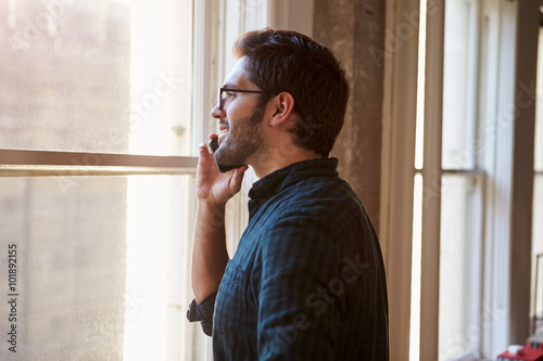 Businessman On Mobile Phone In Office