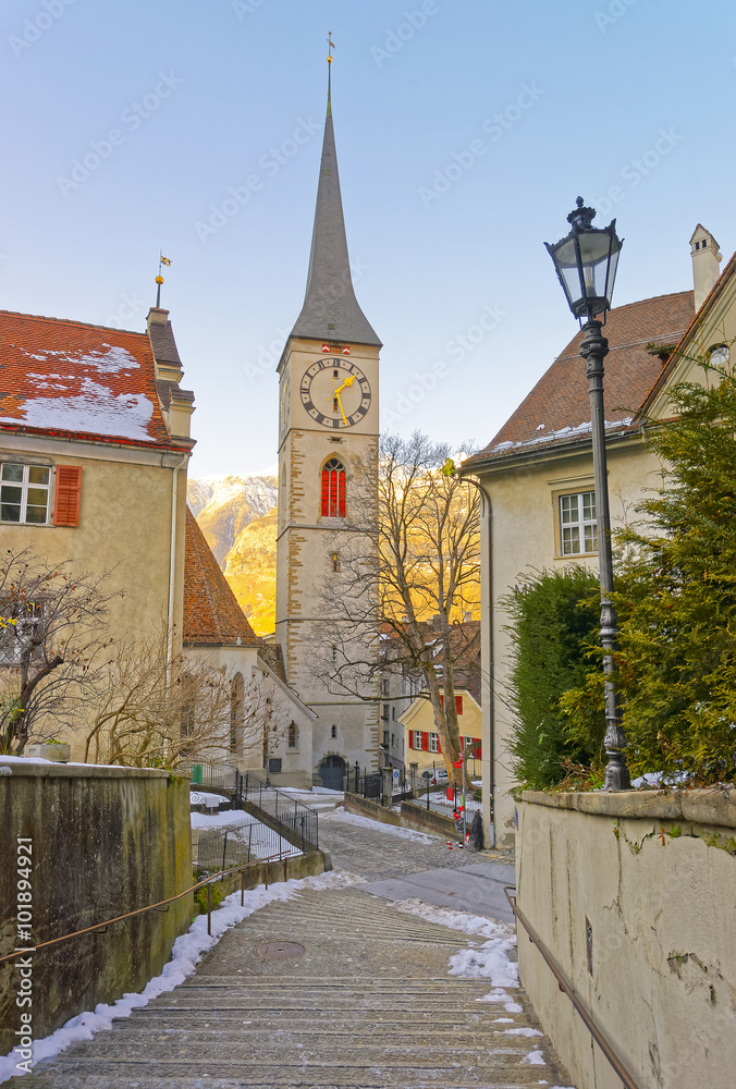 Belfry of Church of St Martin at sunrise in Chur