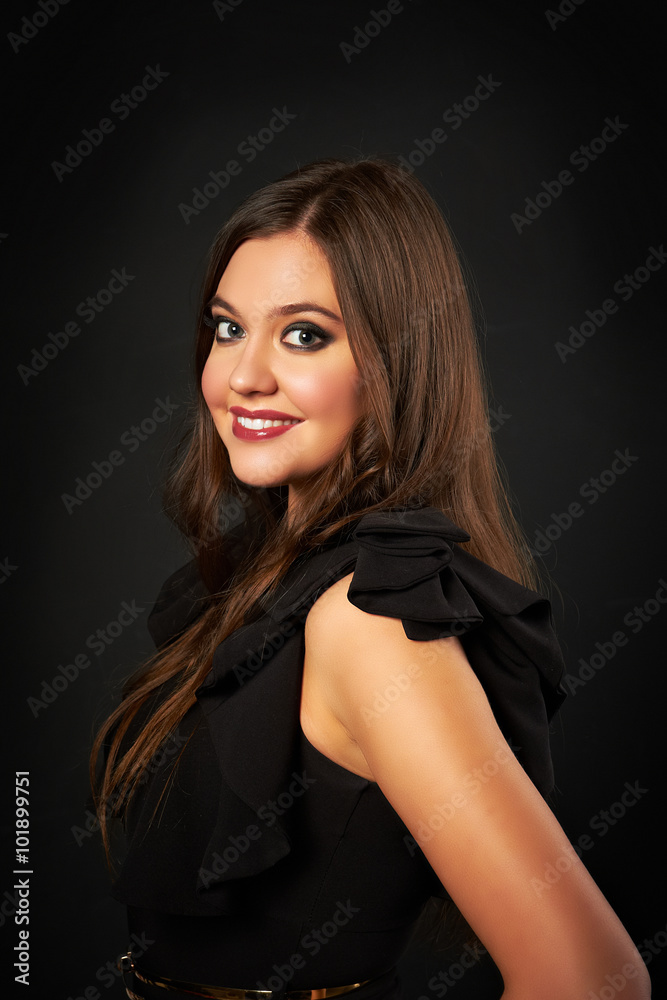 Naklejka premium Portrait of beautiful woman in black dress