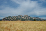 Flatiron Mountains with Dry Grassy Field