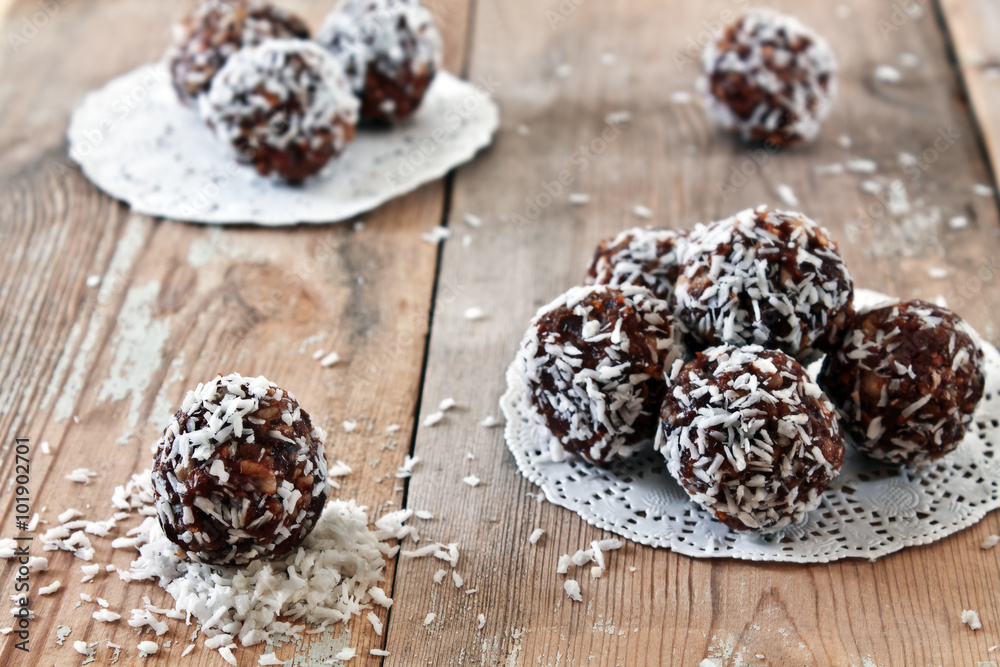 Sweets from figs and nuts in coconut flakes. Handmade. Vedic foo Sweets from figs and nuts in coconut flakes. Handmade. Vedic foo
