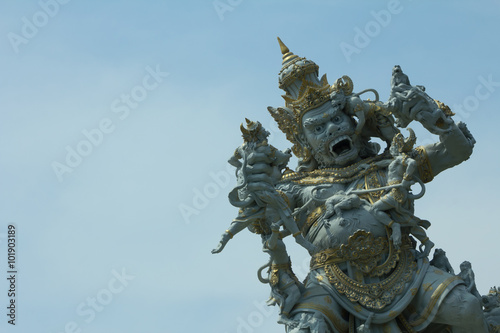 big traditional art statue in bali with clear blue sky