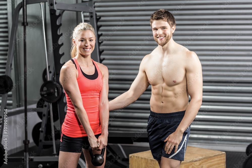 Naklejka premium Couple exercising with dumbbells