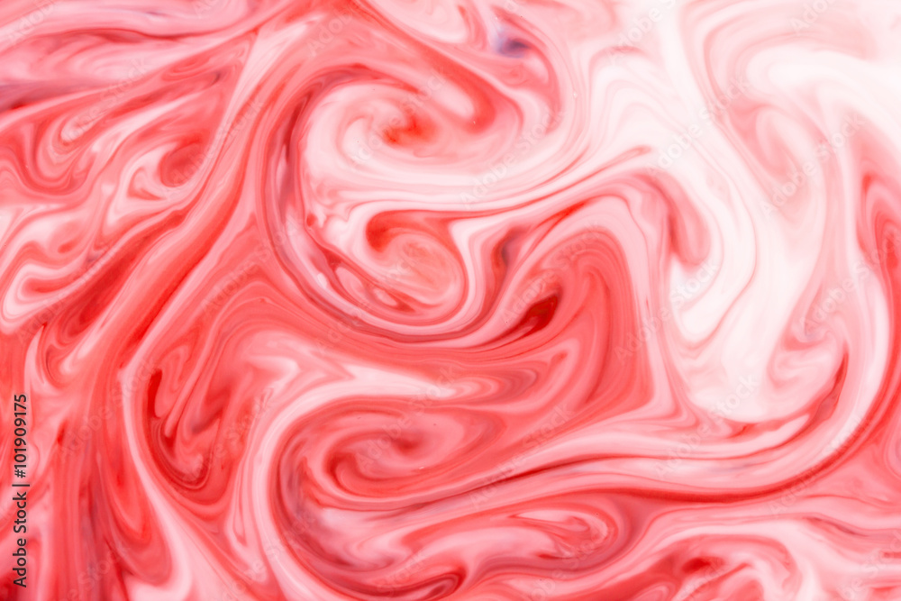 Red and white paint mixing background. Red and white paint mixing background.