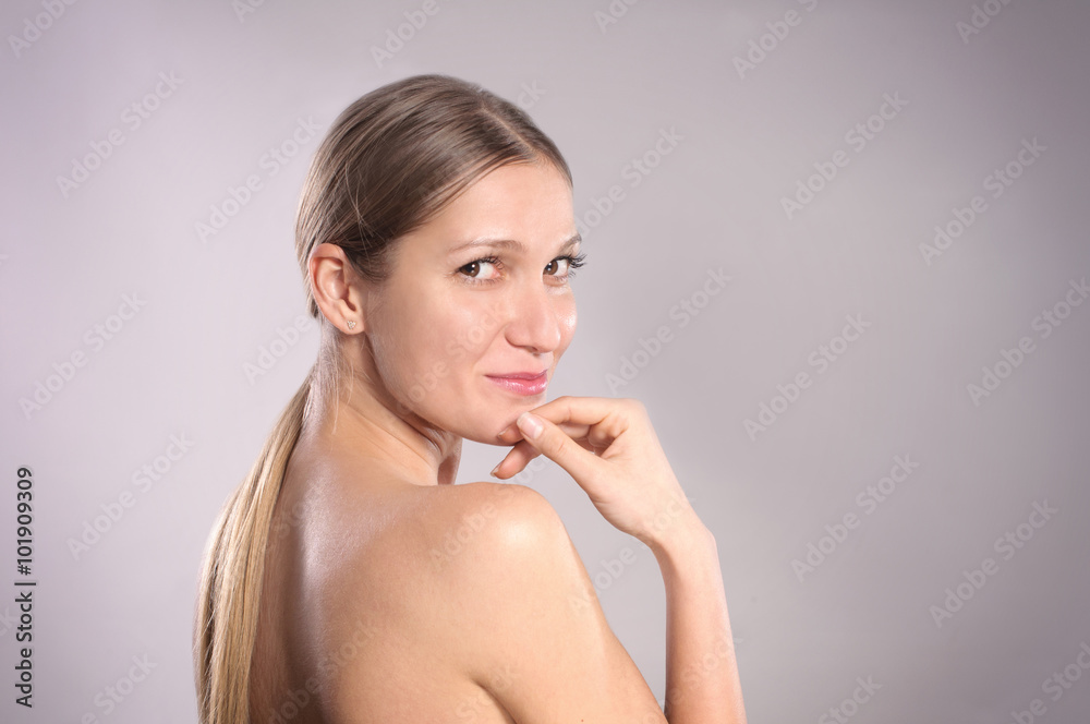 Beautiful Face of Young Woman with Clean Fresh Skin
