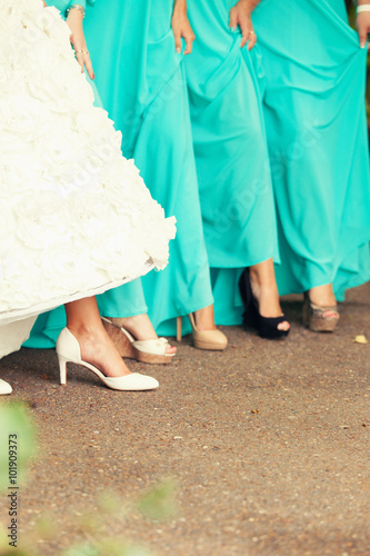 the bride and bridesmaids show feet
