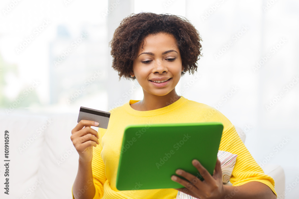 happy african woman with tablet pc and credit card happy african woman with tablet pc and credit card