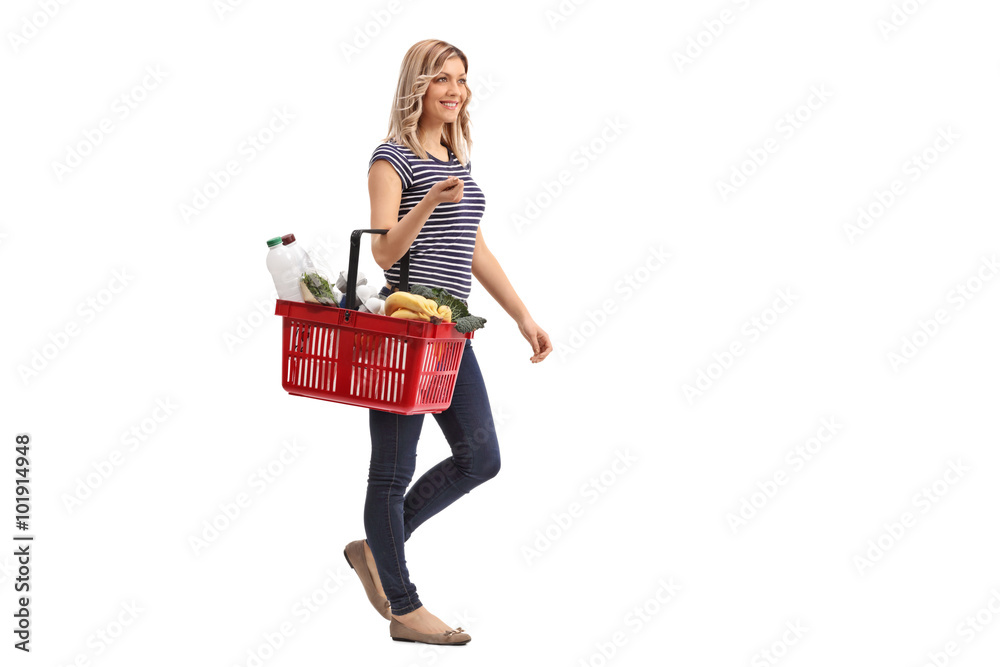 Woman walking and carrying a shopping basket