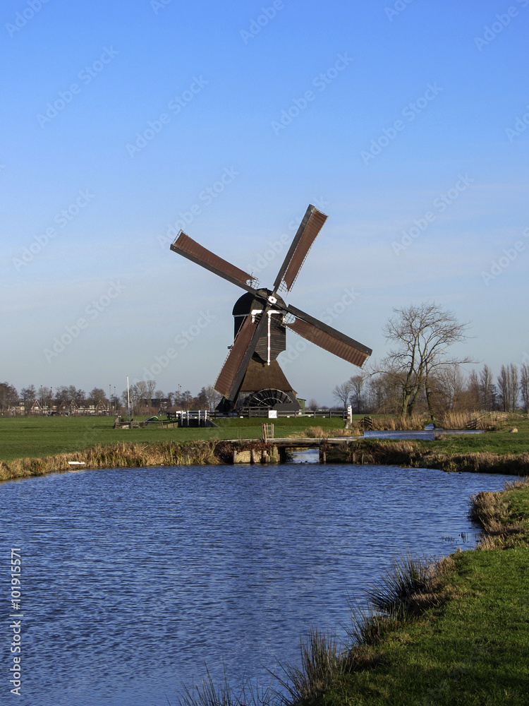 Dutch windmill on blue sky, Streefkerk, South Holland, Netherlands Dutch windmill on blue sky, Streefkerk, South Holland, Netherlands