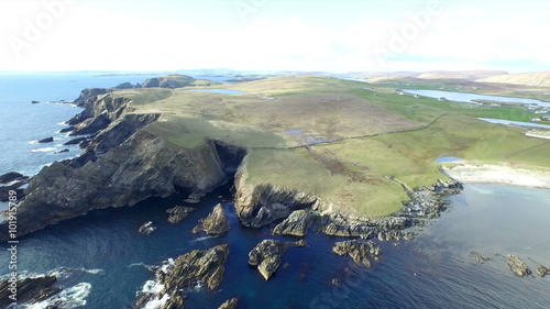 Aerial shot off the dramatic coast line of Shetland, Scotland,
