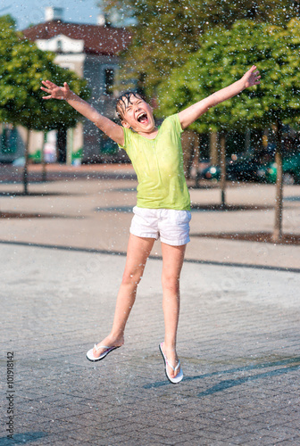 Girl is running through fountains © Serhiy Kobyakov