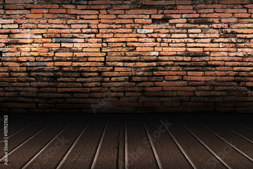 old brick wall and brown wooden floor