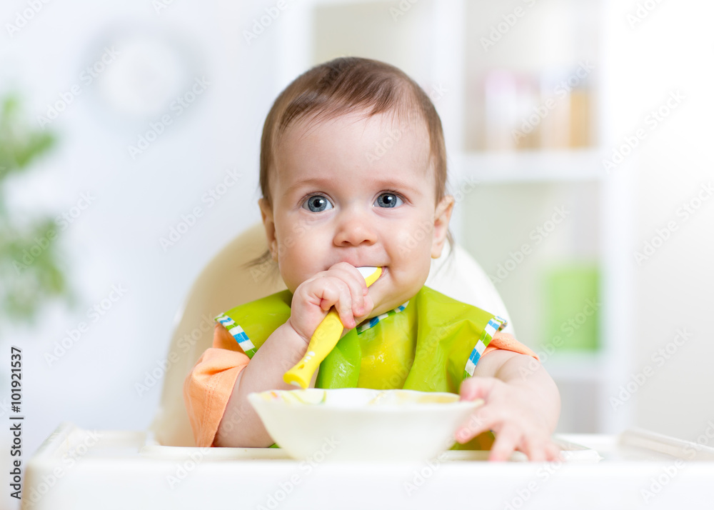 kid baby eating food on kitchen kid baby eating food on kitchen