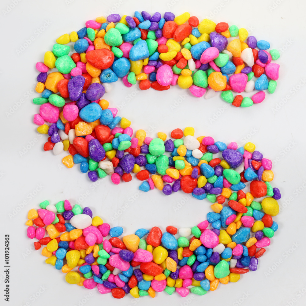 Colored stones arranged in a letter S. Colored stones arranged in a letter S.