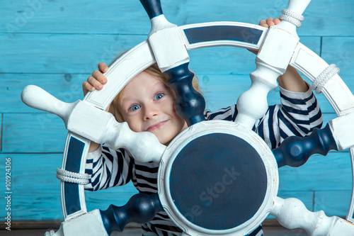child looking through the wheel