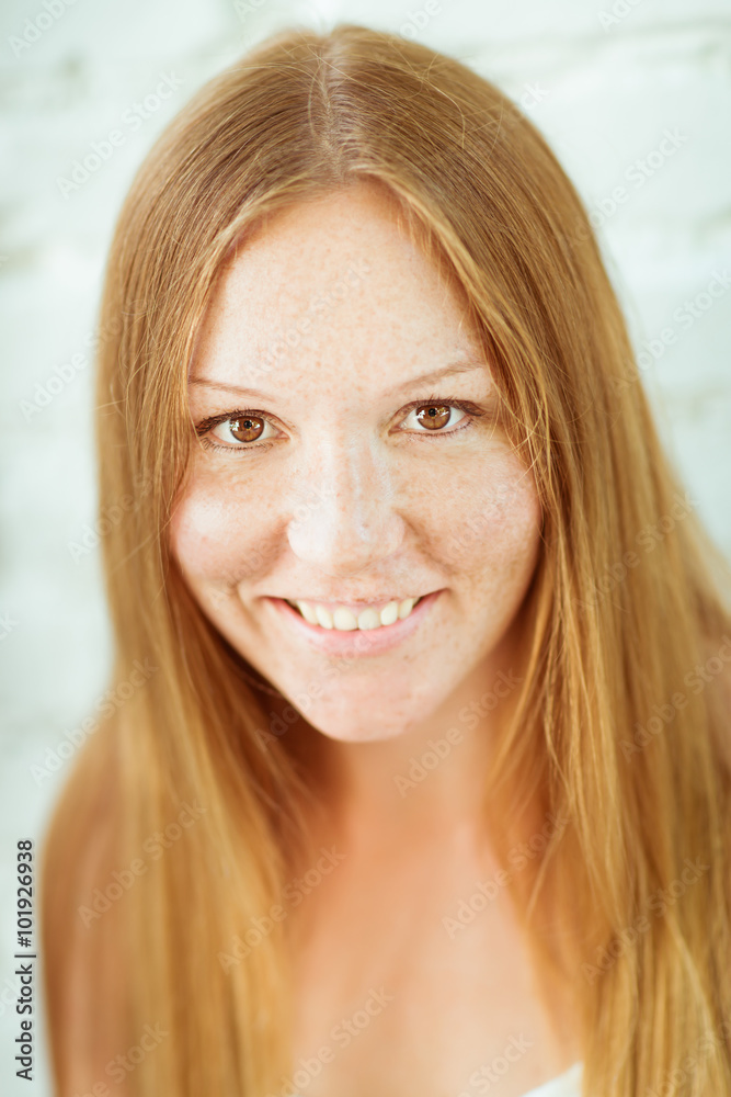 Closeup portrait of adorable red-haired smiling young woman Closeup portrait of adorable red-haired smiling young woman