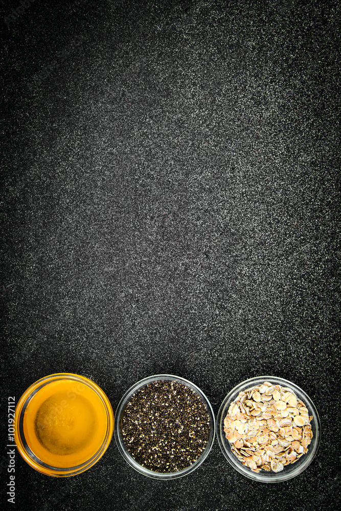 Chia Seeds, Oatmeal, Honey in Glass Bowl Chia Seeds, Oatmeal, Honey in Glass Bowl
