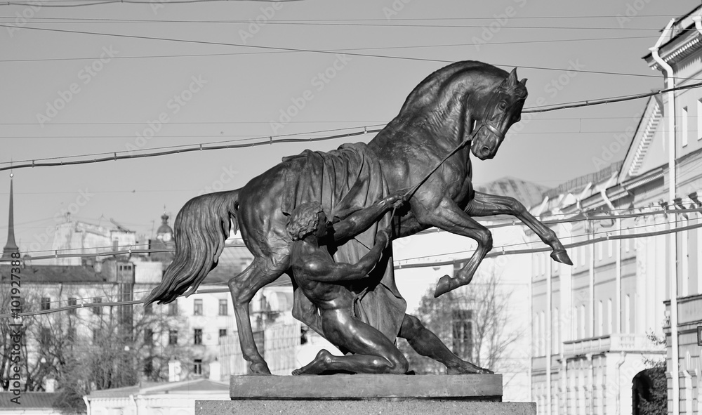 Sculpture Horse Tamers on Anichkov Bridge across Fontanka River, Saint-Petersburg, Russia