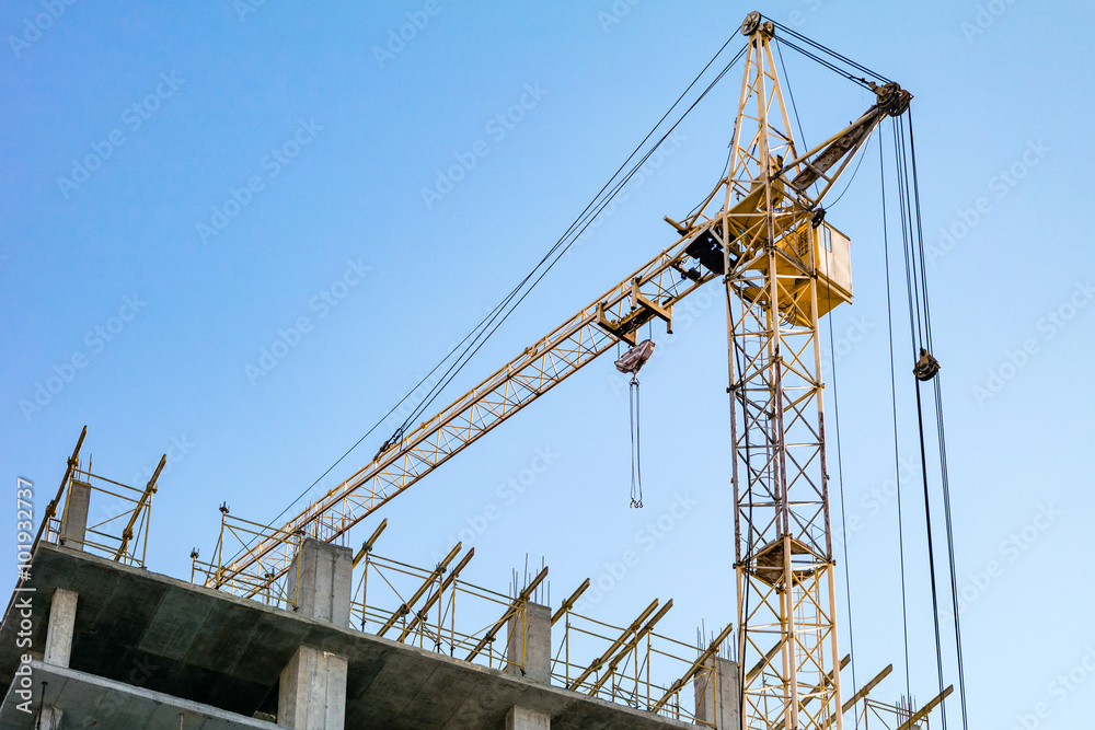 Building under construction and crane. Building under construction and crane.