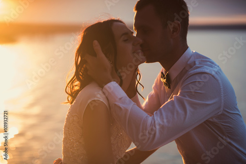 Young couple in love outdoor.Stunning sensual outdoor portrait of young stylish fashion couple posing in summer 
