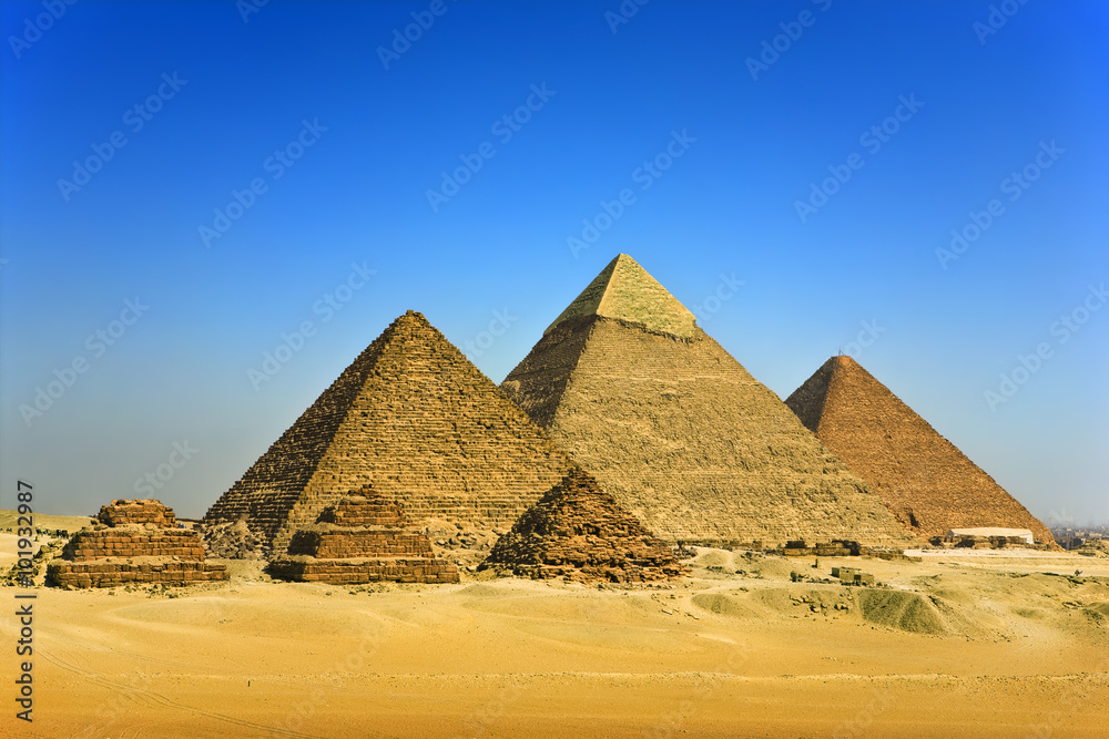 Egypt. Cairo - Giza. General view of pyramids from the Giza Plateau (on front side: 3 pyramids popularly known as Queens' Pyramids; next: the Pyramid of Mykerinos, Chephren and Cheops)