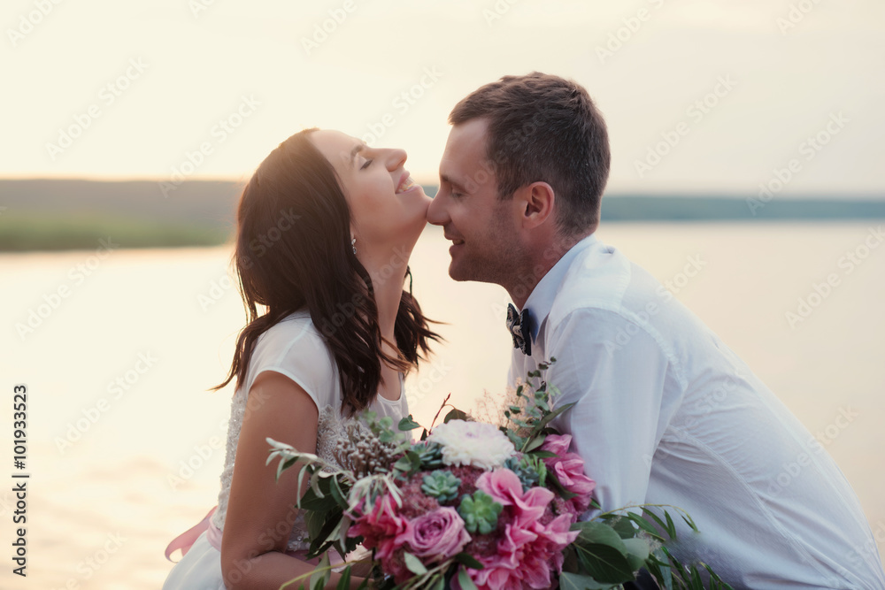 Kissing wedding couple in nature close-up portrait. Kissing wedding couple in nature close-up portrait outdoor 