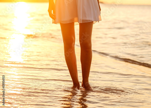 Beautiful girl walking on the beach at sunset, freedom concept © Rock and Wasp