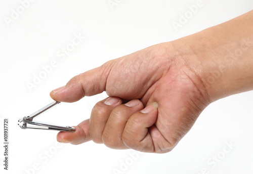 Man hand holding a nail clipper on a white background.