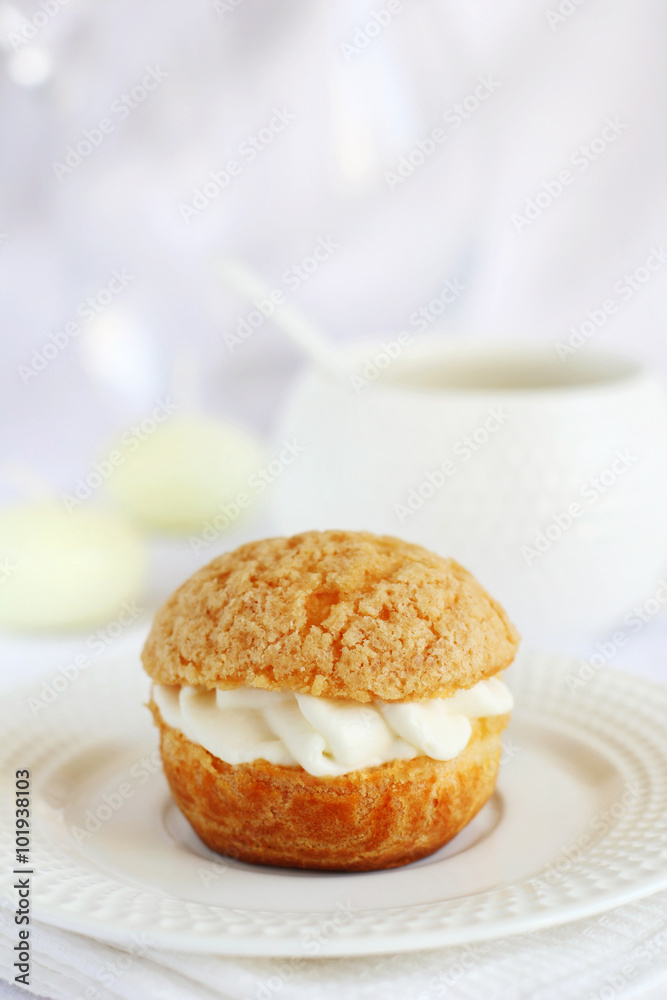 Fotografie profiterole stuffed with cream on a white background