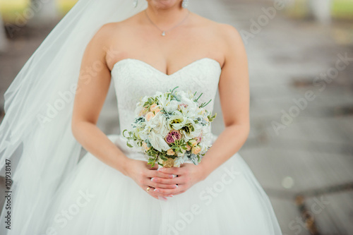 The bride holds a wedding bouquet. flowers