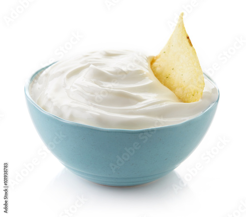 Potato chip and bowl of dip
