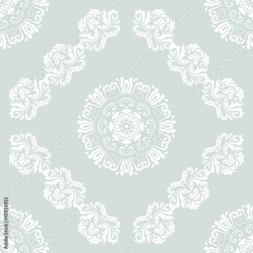 Damask seamless ornament. Traditional light blue and white pattern. Classic oriental background