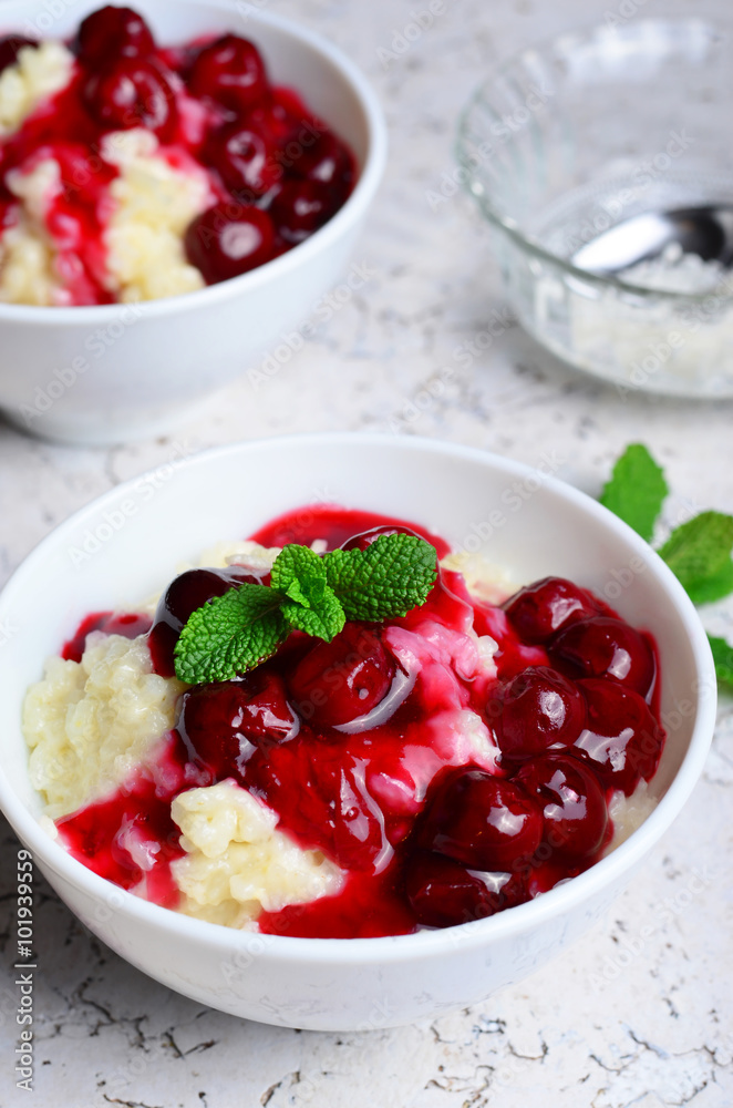Rice Pudding with Cherry Sauce on white background Rice Pudding with Cherry Sauce on white background