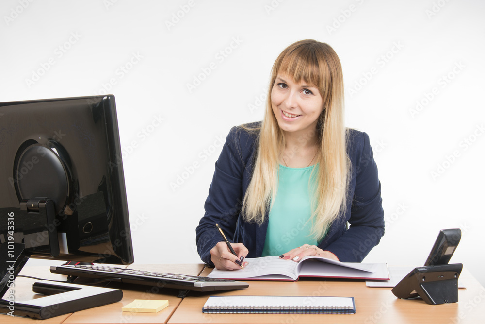 Business woman wrote in a notebook and looked into the frame Business woman wrote in a notebook and looked into the frame