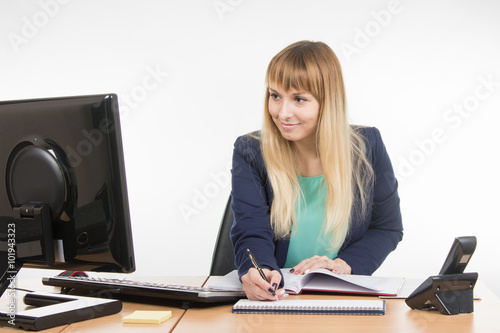 Business woman writes in diary appointment reminder