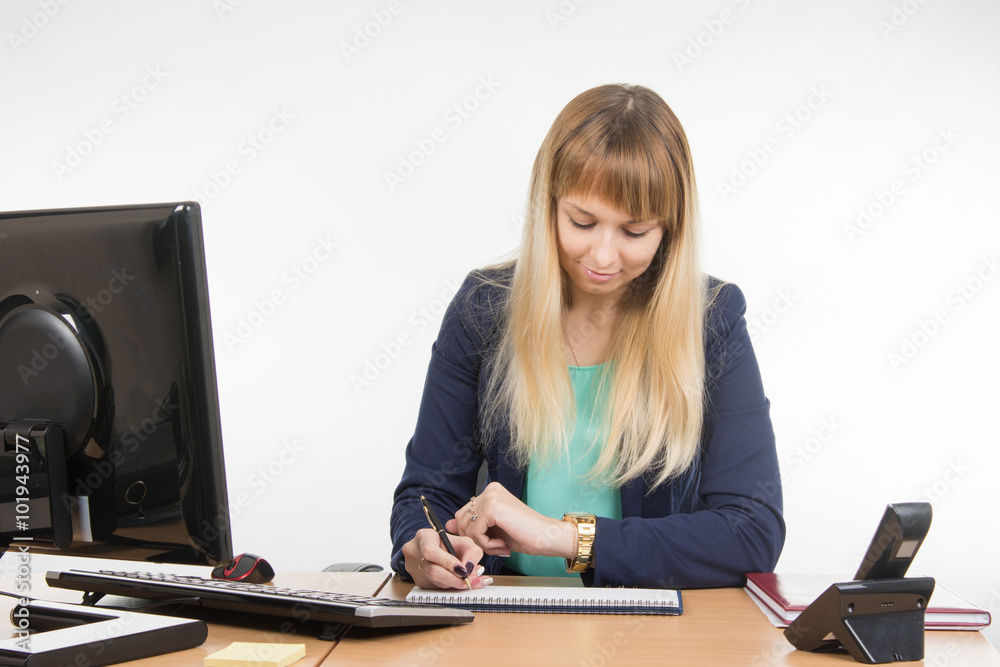 Business woman looking at his watch and schedule of the working day Business woman looking at his watch and schedule of the working day