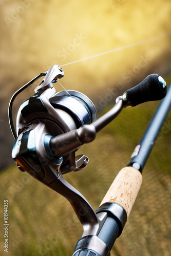 fishing tackle on a wooden table. toned image 