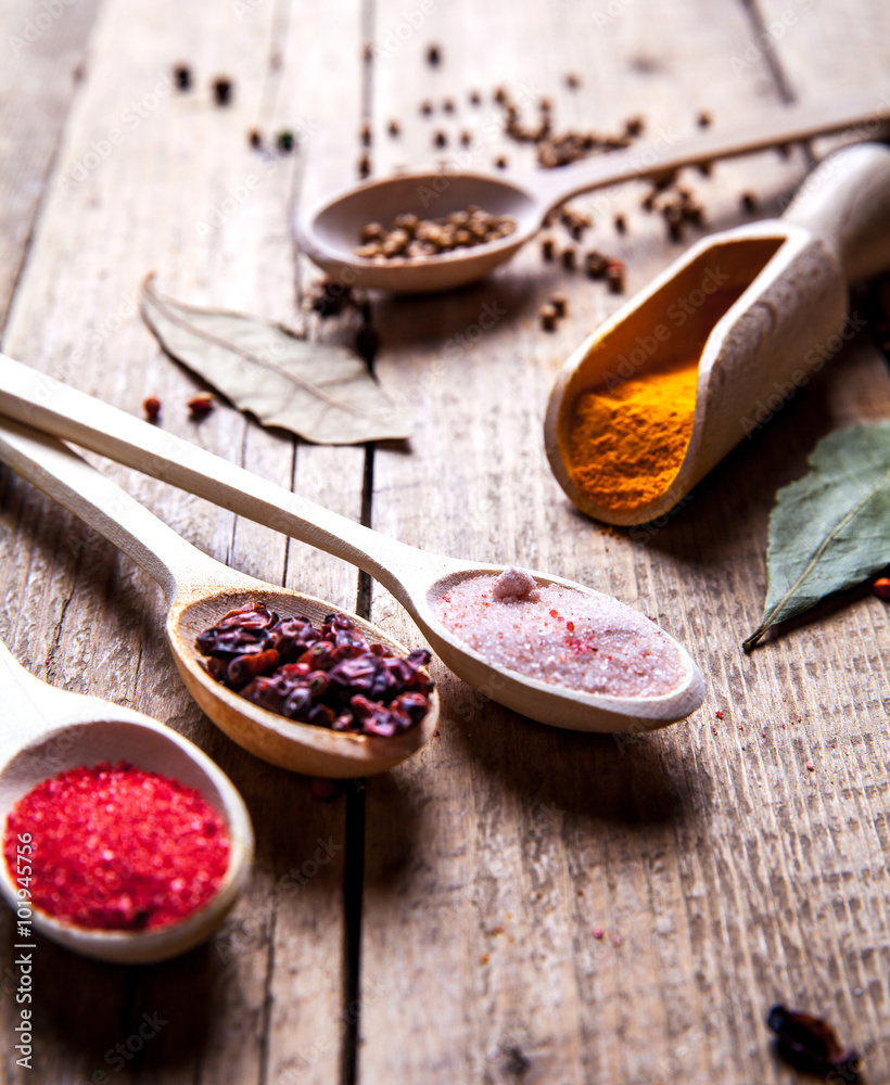 Spices on wooden background. With empty space for advertising text