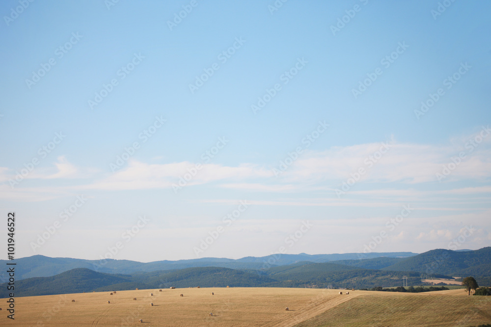Beautiful open field against mountains Beautiful open field against mountains