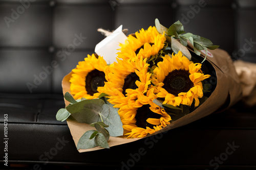 Fototapeta Naklejka Na Ścianę i Meble -  Bouquet of sunflowers on dark background