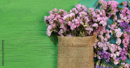 Fototapeta Naklejka Na Ścianę i Meble -  Beautiful flowers on green wood.